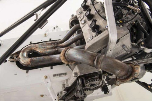 The engine is mounted in the chassis in such a way that the exhaust exits the side. This helps reduce heat under the seat and reduce snow sticking to the tunnel. We've seen where some snow conditions can fill a Yamaha tunnel with snow and cause ice to freeze around the exhaust. The SRV Chassis alleviates this.