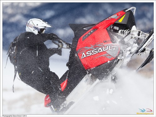 The author standing the 2014 Polaris Assault on its tail
