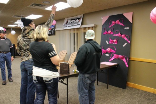 Bra-pong. 3 tries for a buck. Cost me two and I still couldn't hit the cup.