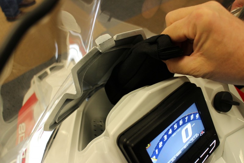 Integrated storage, like this small compartment that keeps a fresh pair of goggles or gloves ready and warm.