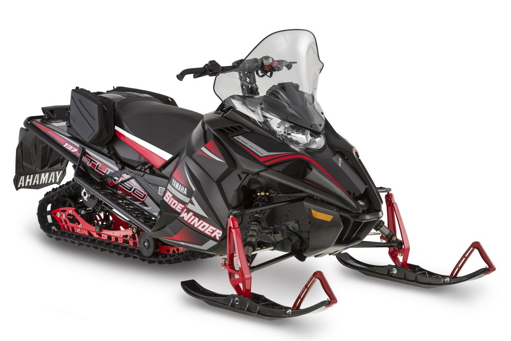 Sidewinder S-TX DX with tall windshield, large rear bag, and removable saddle bags.